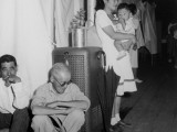 30 June 1942. Manzanar Relocation Center, Manzanar, California. A typical interior scene in one of the barrack apartments at this center. Note the cloth partition which lends a small amount of privacy. National Archives, 538136.