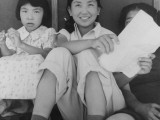  Manzanar Relocation Center, Manzanar, California. Evacuee girls practicing the songs they learned in school prior to evacuation to this War Relocation Authority center for evacuees of Japanese ancestry. National Archives, 538089