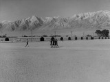  Manzanar Relocation Center, Manzanar, California. General view of this War Relocation Authority center located in Owens Valley looking east across the wide fire-break which separates blocks of barracks. National Archives, 538122.