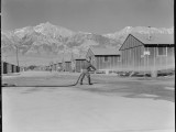 2 July 1942. Manzanar Relocation Center, Manzanar, California. Fire equipment is used to keep the dust down at this War Relocation Authority Center, National Archives, 538163.