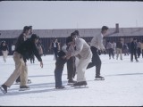 ce-skating was a popular winter activity at Heart Mountain. Prisoners used fire hoses to create several skating areas around the camp. Here, in the middle of a crowd of skaters, Billy Manbo gets a lesson.