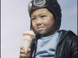 Billy Manbo eats ice cream in his pilot outfit.